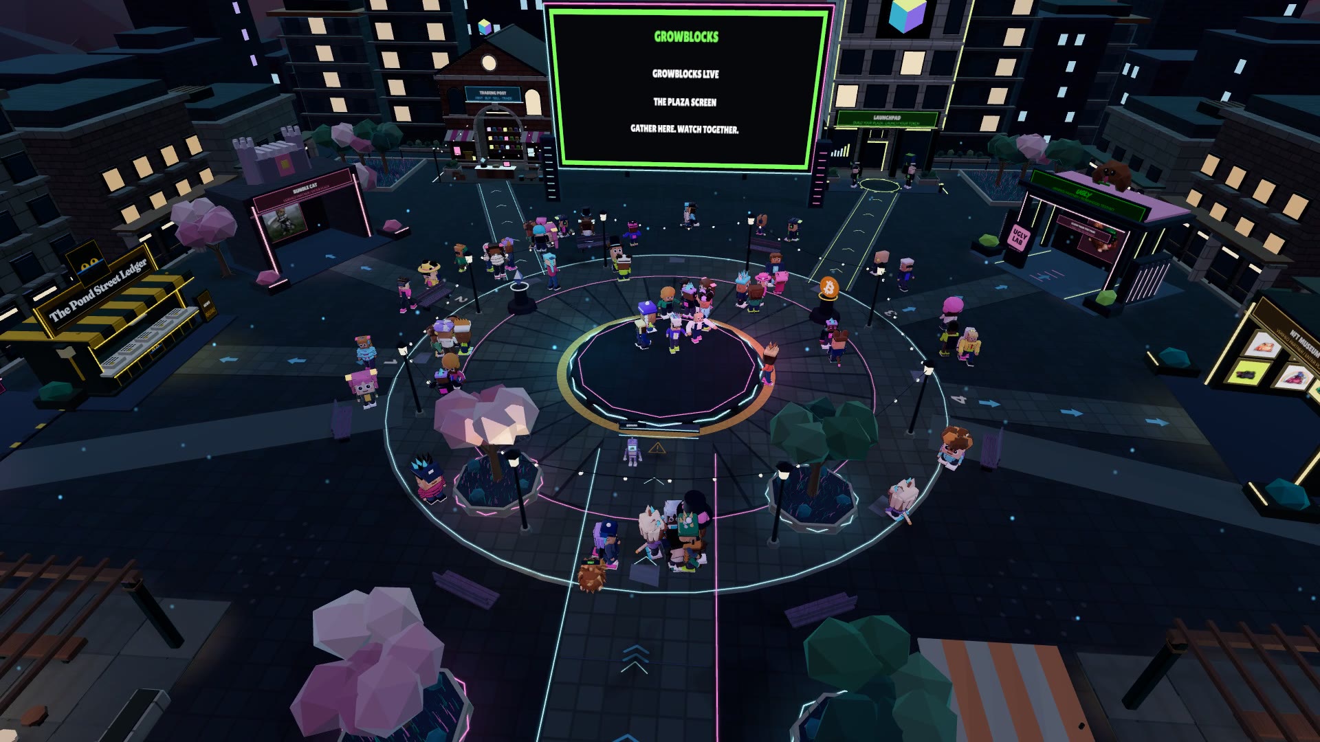 An aerial view of the GrowBlocks main plaza at night: a round stage ringed with neon, characters gathered around it, a giant screen and lit buildings on every side